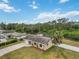 Aerial view of single-Gathering home with large backyard and surrounding trees at 5296 Rolla Rd, Venice, FL 34293