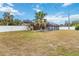 Spacious backyard with grassy area and pool at 5296 Rolla Rd, Venice, FL 34293