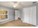 Gray bedroom with carpet, ceiling fan, and window at 5296 Rolla Rd, Venice, FL 34293