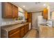 Bright kitchen with wood cabinets and ample counter space at 5296 Rolla Rd, Venice, FL 34293