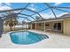 Relaxing pool area with screened enclosure at 5296 Rolla Rd, Venice, FL 34293