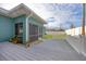 Gray composite deck and fenced backyard at 5298 Drew Rd, Venice, FL 34293