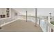 Spacious loft area with carpeted floors and built in shelves at 5298 Drew Rd, Venice, FL 34293