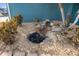 Relaxing outdoor water feature with rocks and plants at 5298 Drew Rd, Venice, FL 34293