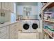 Laundry room with washer, dryer and cabinets at 589 Pond Willow Ln, Venice, FL 34292