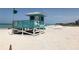 Lifeguard stand on sandy beach with ocean view at 589 Pond Willow Ln, Venice, FL 34292