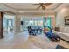 Bright living room with sliding doors opening to lanai at 589 Pond Willow Ln, Venice, FL 34292