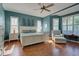 Main bedroom with king-size bed, hardwood floors, and window at 589 Pond Willow Ln, Venice, FL 34292