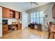 Home office with wood built-ins and hardwood floors at 589 Pond Willow Ln, Venice, FL 34292