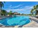 Large community pool with fountain and surrounding landscaping at 589 Pond Willow Ln, Venice, FL 34292