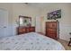 Bedroom featuring a dresser and TV at 746 Fringed Orchid Trl, Venice, FL 34293