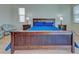 Bedroom with wood flooring and blue bedding at 746 Fringed Orchid Trl, Venice, FL 34293