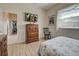 Bedroom with wood floors and built in shelving at 746 Fringed Orchid Trl, Venice, FL 34293