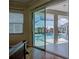 Bedroom with sliding doors opening to the pool at 746 Fringed Orchid Trl, Venice, FL 34293