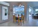 Cozy breakfast nook with view of the pool and sliders to lanai at 746 Fringed Orchid Trl, Venice, FL 34293