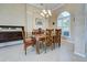 Formal dining room featuring a wood table, chandelier, and antique buffet at 746 Fringed Orchid Trl, Venice, FL 34293