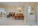 Bright dining room with tile flooring and access to kitchen at 746 Fringed Orchid Trl, Venice, FL 34293