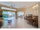 Open living space with tile floors and access to pool area at 746 Fringed Orchid Trl, Venice, FL 34293