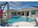 Inviting pool area with covered lanai and spa at 746 Fringed Orchid Trl, Venice, FL 34293