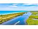 Boat on waterway next to beach and mangrove at 121 Amora Ave, Venice, FL 34285