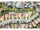 Aerial view of houses with solar panels and pools at 121 Amora Ave, Venice, FL 34285