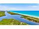Waterway leading to ocean; mangrove and beach at 121 Amora Ave, Venice, FL 34285
