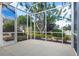 Landscaped backyard with lush greenery and mature trees at 121 Amora Ave, Venice, FL 34285