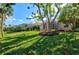 Private backyard oasis with lush landscaping at 121 Amora Ave, Venice, FL 34285