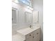 Bathroom with single sink vanity and large mirror at 121 Amora Ave, Venice, FL 34285