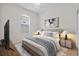 Bedroom with arched window and ceiling fan at 121 Amora Ave, Venice, FL 34285