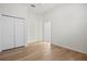 Bedroom with double door closet and wood floors at 121 Amora Ave, Venice, FL 34285