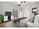 Main bedroom with sliding glass doors to lanai at 121 Amora Ave, Venice, FL 34285
