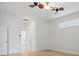 Bright bedroom with wood-look floors and ceiling fan at 121 Amora Ave, Venice, FL 34285