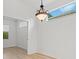 Bright dining room features a chandelier and view to backyard at 121 Amora Ave, Venice, FL 34285