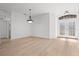 Dining room with hardwood floors and double doors leading outside at 121 Amora Ave, Venice, FL 34285