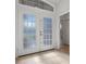 Bright entryway with double doors and wood-look flooring at 121 Amora Ave, Venice, FL 34285