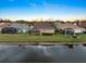 Aerial perspective of homes near a lake at 1307 Highland Greens Dr, Venice, FL 34285