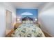 Bedroom with a floral bedspread and blue walls, featuring a window seat at 1307 Highland Greens Dr, Venice, FL 34285