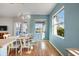 Dining room features hardwood floors and natural light at 1307 Highland Greens Dr, Venice, FL 34285
