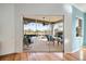View of an enclosed patio with seating and a screened enclosure at 1307 Highland Greens Dr, Venice, FL 34285