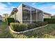 House exterior showcasing a screened lanai at 1307 Highland Greens Dr, Venice, FL 34285