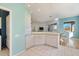 Kitchen features white cabinets, granite countertops, and access to dining area at 1307 Highland Greens Dr, Venice, FL 34285