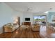 Living room with hardwood floors, neutral colors, and ample natural light at 1307 Highland Greens Dr, Venice, FL 34285