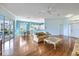 Spacious living area with hardwood floors and views to kitchen and backyard at 1307 Highland Greens Dr, Venice, FL 34285