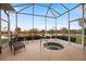 Private spa and screened lanai overlooking lake at 1307 Highland Greens Dr, Venice, FL 34285