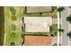 Aerial view of home and lake at 13510 Esposito St, Venice, FL 34293