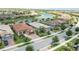 Aerial view of neighborhood by lake at 13510 Esposito St, Venice, FL 34293