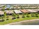 Aerial view of homes near lake at 13510 Esposito St, Venice, FL 34293