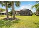 House with a screened patio and a beautiful backyard at 13510 Esposito St, Venice, FL 34293