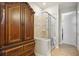 Bathroom featuring a walk-in shower and built-in storage at 13510 Esposito St, Venice, FL 34293